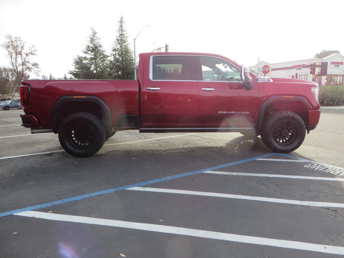 2021 MAROON /BLACK GMC Sierra 3500HD Denali (1GT49WEY1MF) with an Duramax 6.6L Turbo Diesel engine, 10 speed transmission, located at 2630 Grass Valley Highway, Auburn, CA, 95603, (530) 508-5100, 38.937893, -121.095482 - Duramax sitting on a BDS level kit with upper control arms and Fox shocks, 20" XD wheels, and 35" Nitto Ridge Grappler tires. - Photo#3